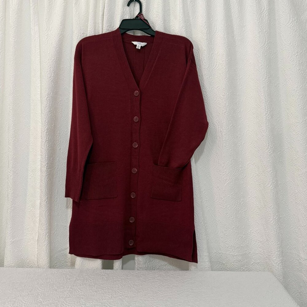 woman's mid-length sweater. Button down. Functional Pockets.